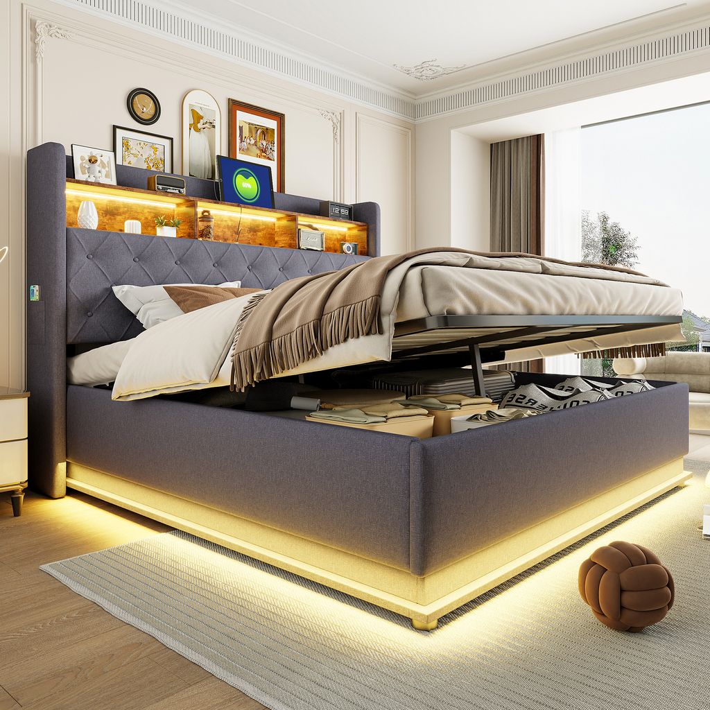A modern bedroom with a large upholstered bed featuring built-in LED lighting and storage.