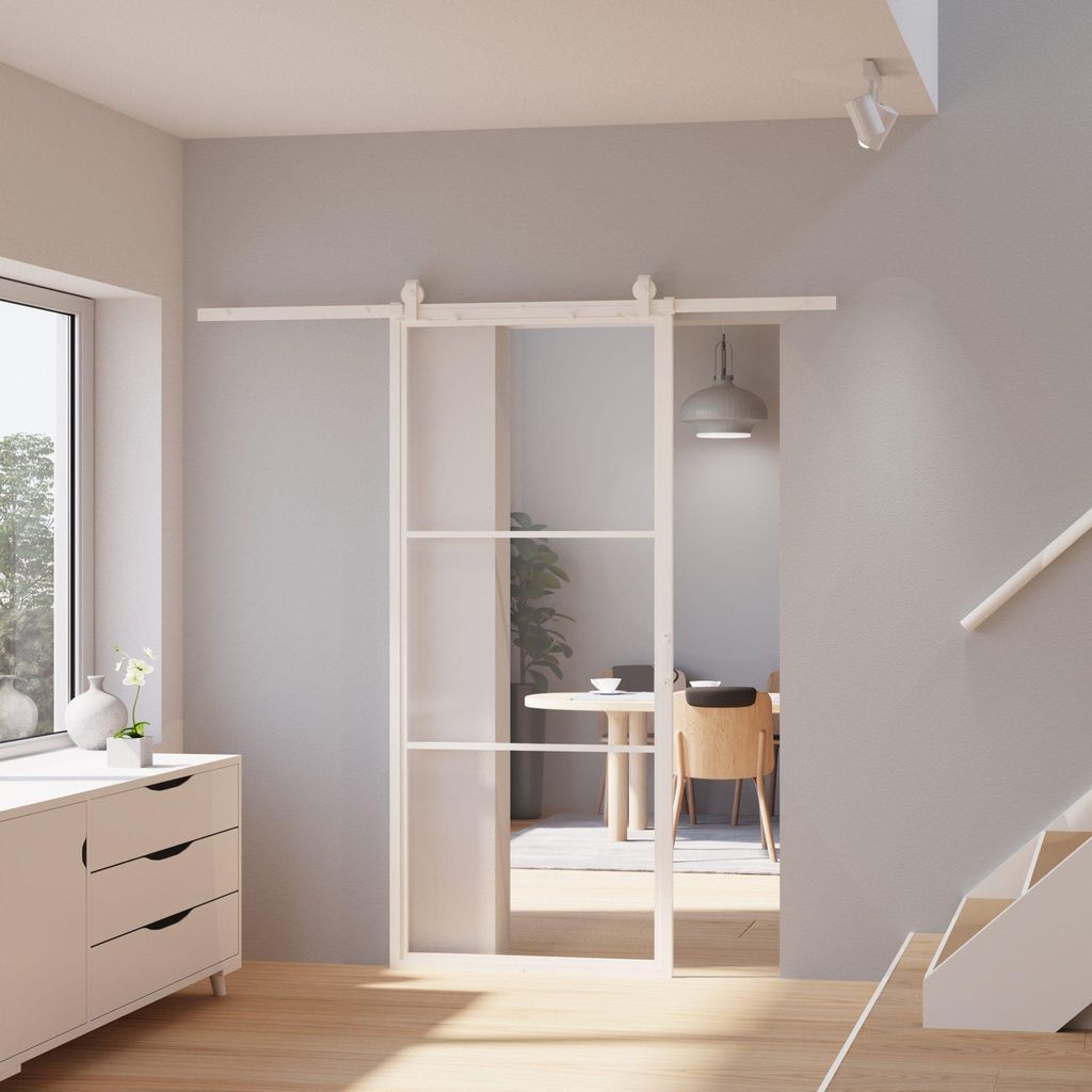 weiß gerahmte Glasschiebetür aus Klarglas in modernem, hellem Wohnraum
