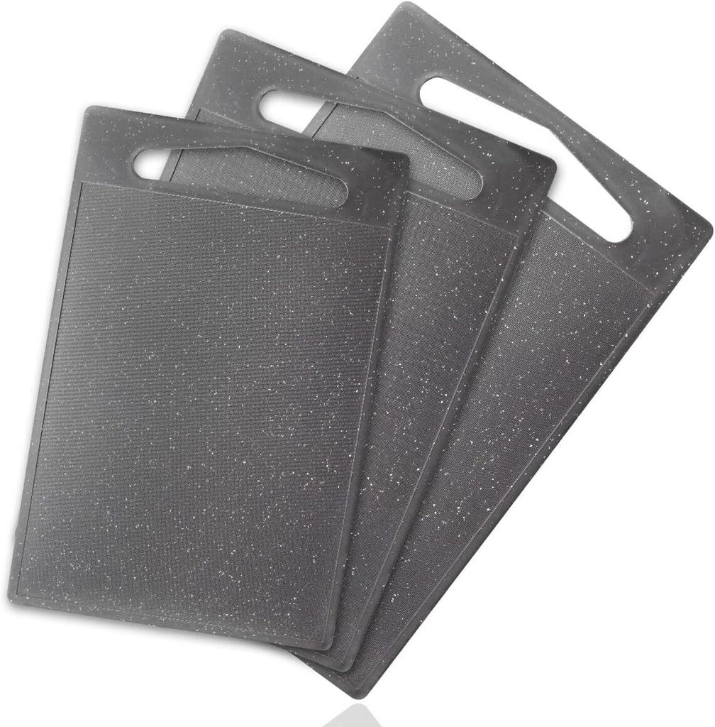 A set of three gray cutting boards stacked on a white background.
