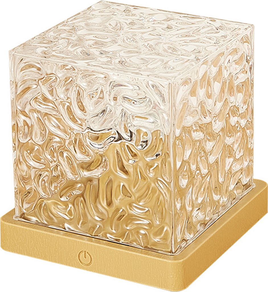 A cube-shaped lamp with a textured glass exterior and a gold base.