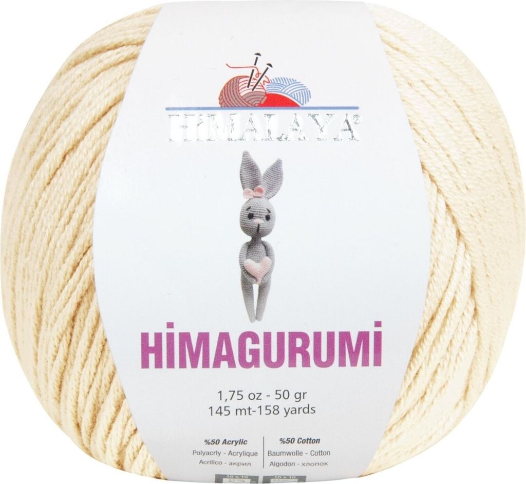 A ball of cream-colored yarn with a label featuring a knitted bunny illustration and product details.