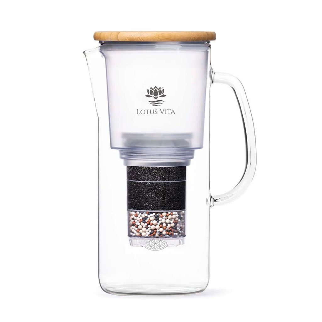 A glass water filter pitcher with a bamboo lid, standing against a white background.