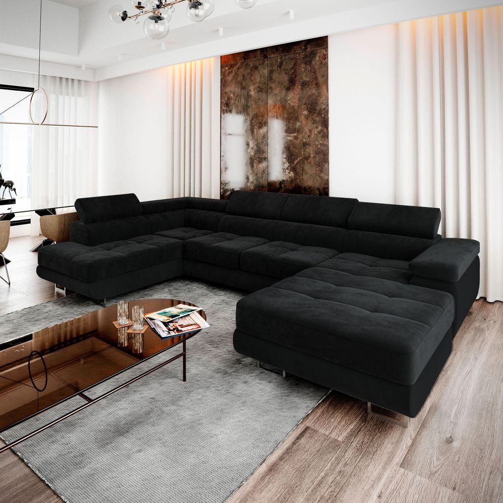 A modern living room with a sectional sofa, coffee table, and artwork.