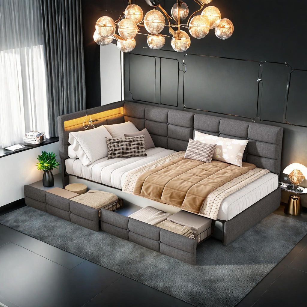 90 x 200 cm großes Bett mit grauem Stoffbezug, L-förmigem Kopfteil, integrierten LEDs, Ladeanschlüssen und einer Schublade am Fußende.