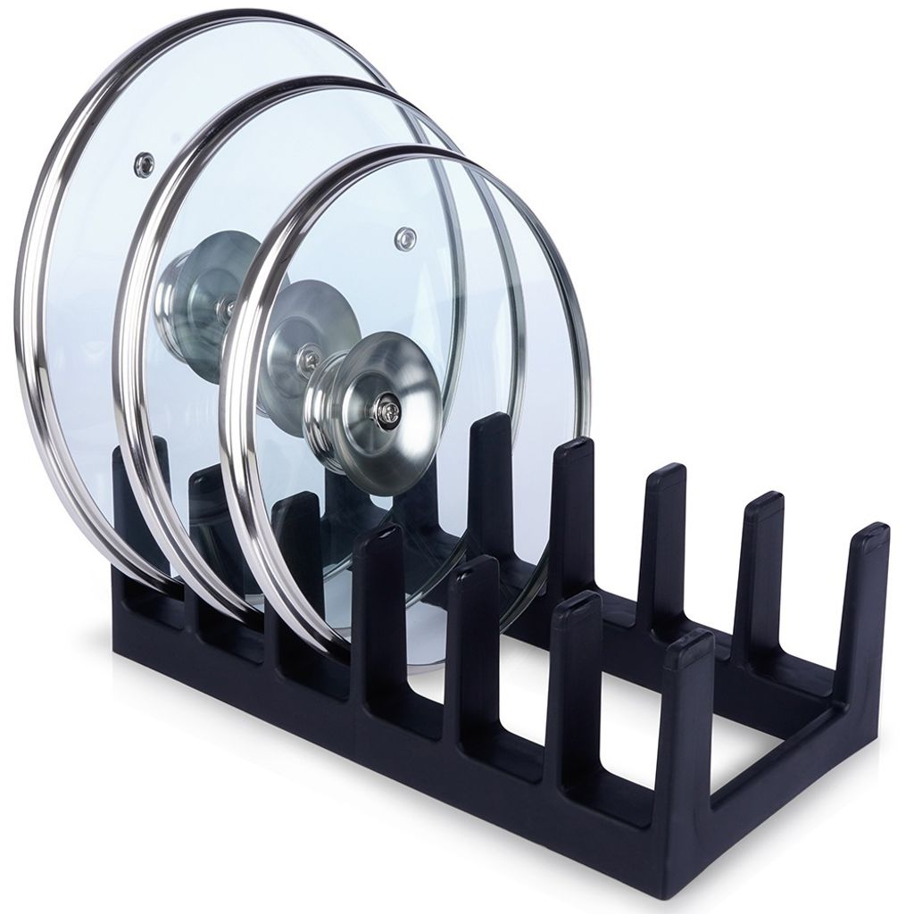 A black pot lid organizer holding three glass pot lids.