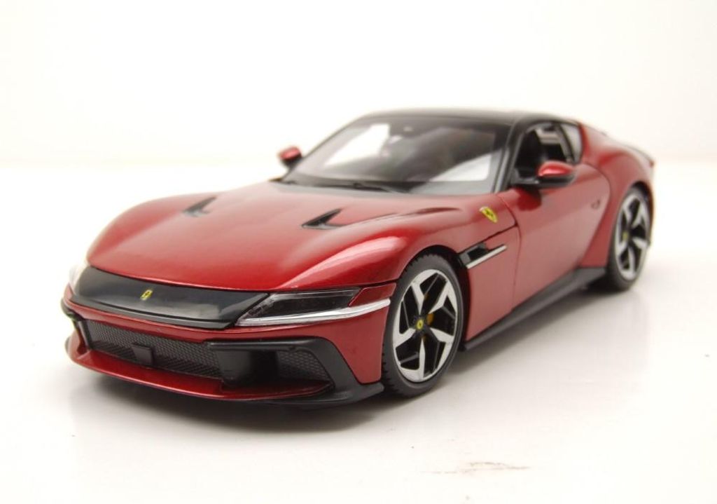 A red Ferrari 12 Cilindri model car is shown from a three-quarter front angle on a white background.