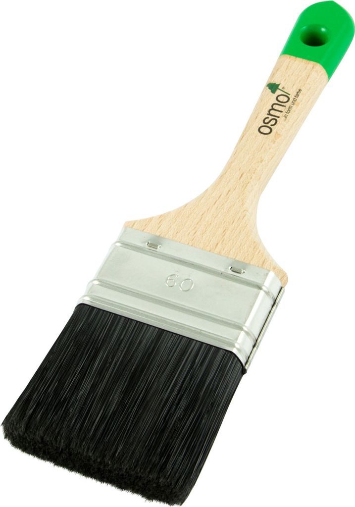 A paintbrush with black bristles and a wooden handle with a green end.