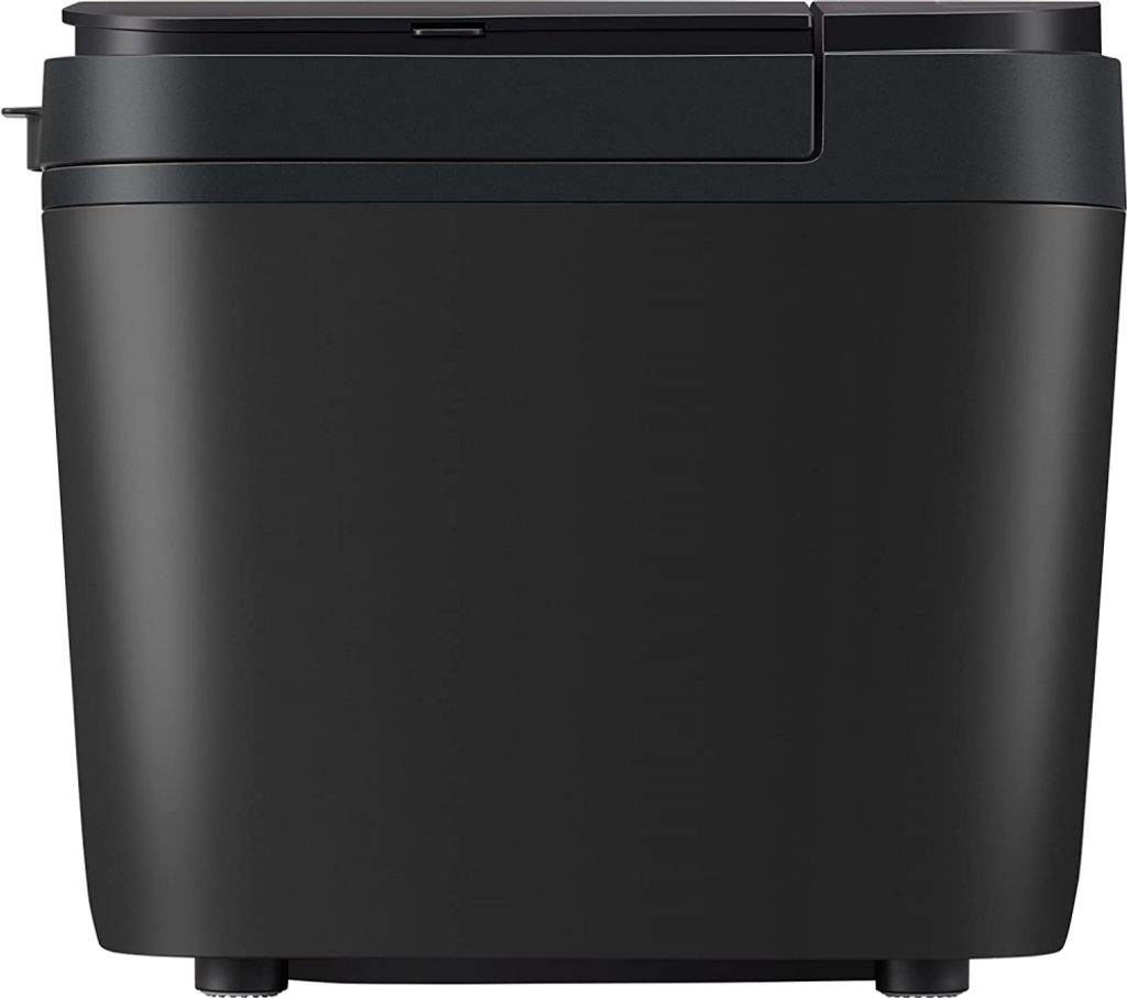 A front view of a black bread maker.