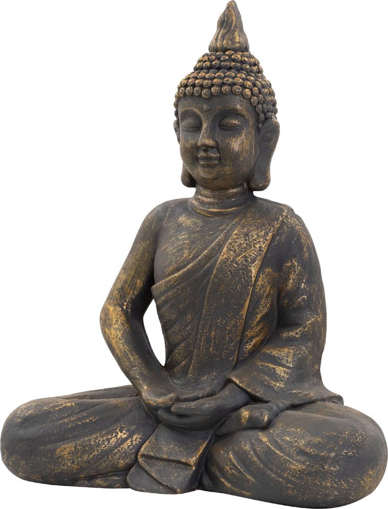 A statue of Buddha sitting in meditation.