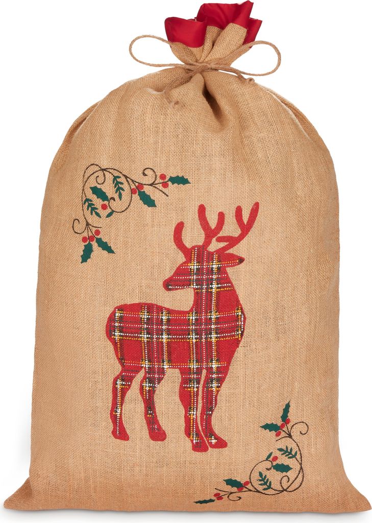 A burlap Christmas sack with a red plaid reindeer design and holly accents, tied at the top with twine and a red fabric ribbon.