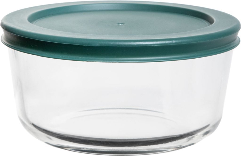 A clear glass food storage container with a green lid.