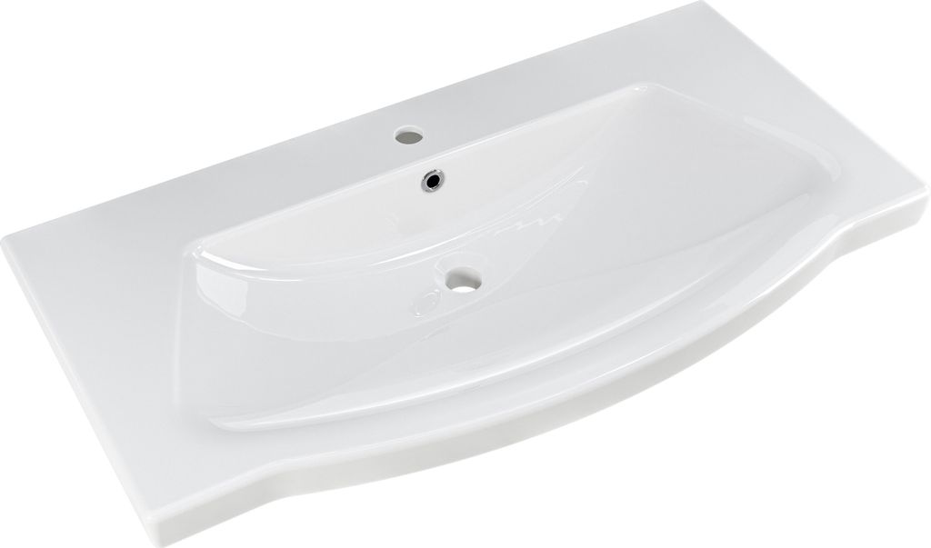A white ceramic sink with a wide, flat countertop.