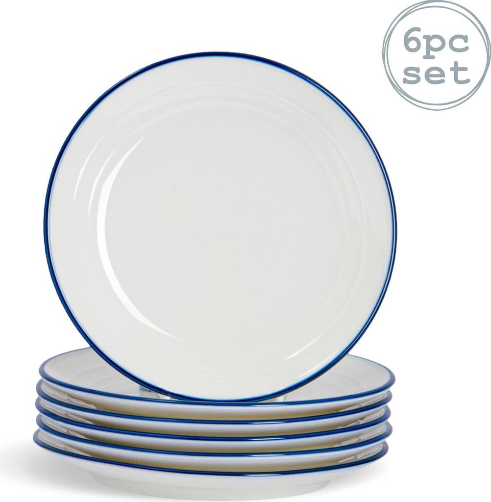 A stack of white dessert plates with blue rims, with one plate slightly offset on top.