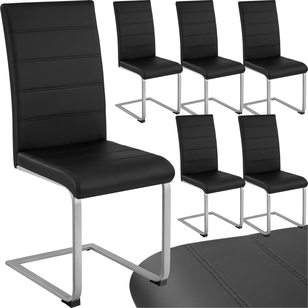 A set of black dining chairs with silver legs arranged on a white background.