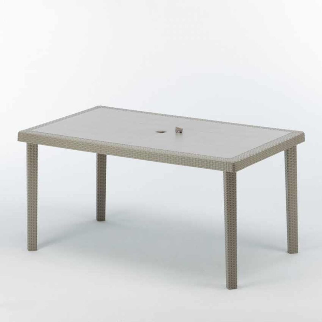 A rectangular outdoor dining table with a woven rattan base and a glass top, shown against a white background.