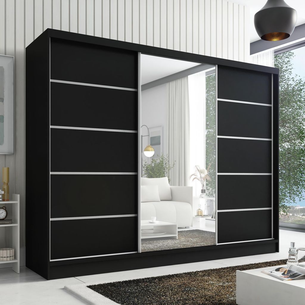 A black wardrobe with mirrored doors in a room setting.