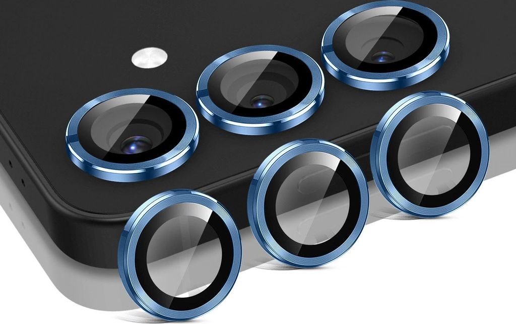 A close-up shot of multiple blue camera lens protectors arranged on a dark surface.