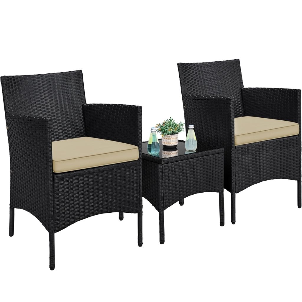 A black rattan garden furniture set with khaki cushions, consisting of two chairs and a small table, is displayed against a white background.
