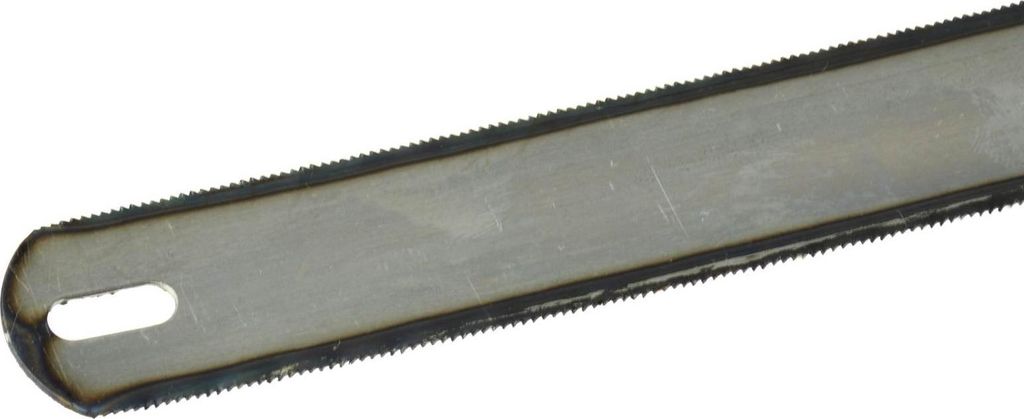 A close-up view of a metal saw blade with teeth along the edge and a hole at one end.