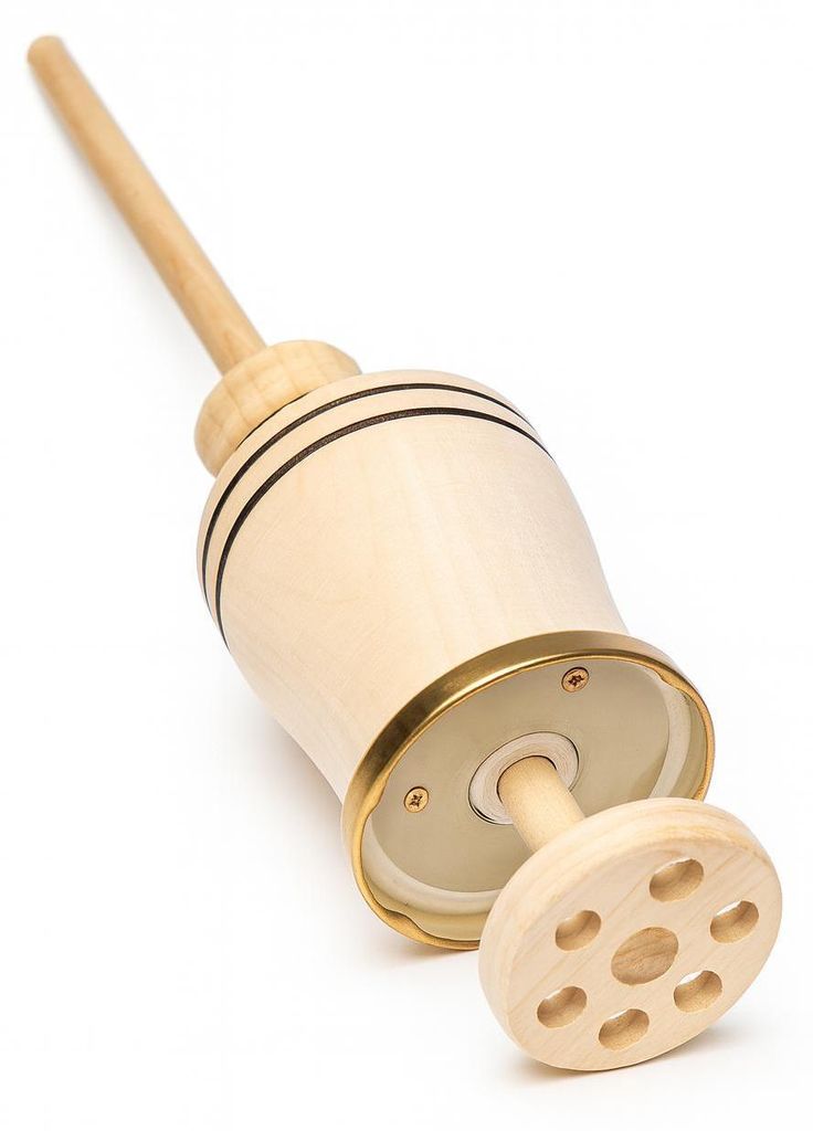 A wooden butter churn on a white background.