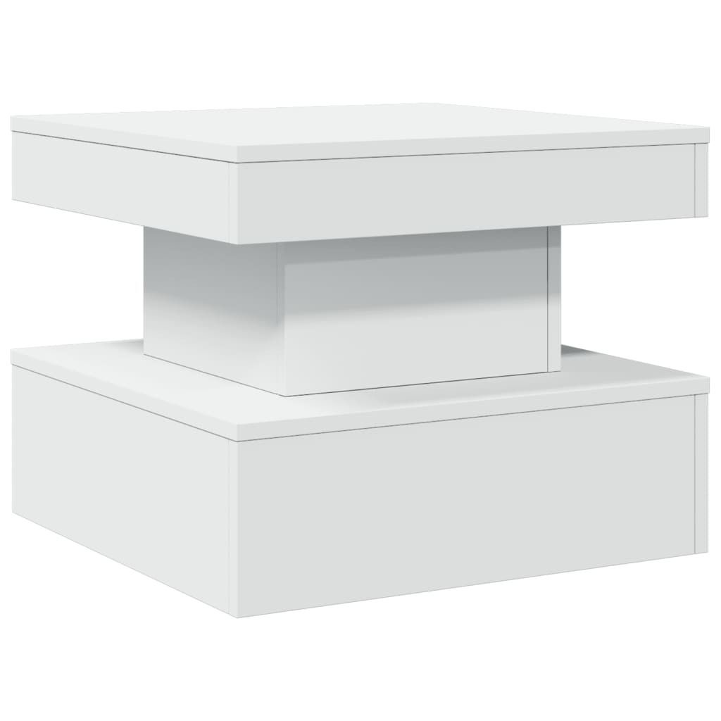 A modern white coffee table with a stacked, geometric design.