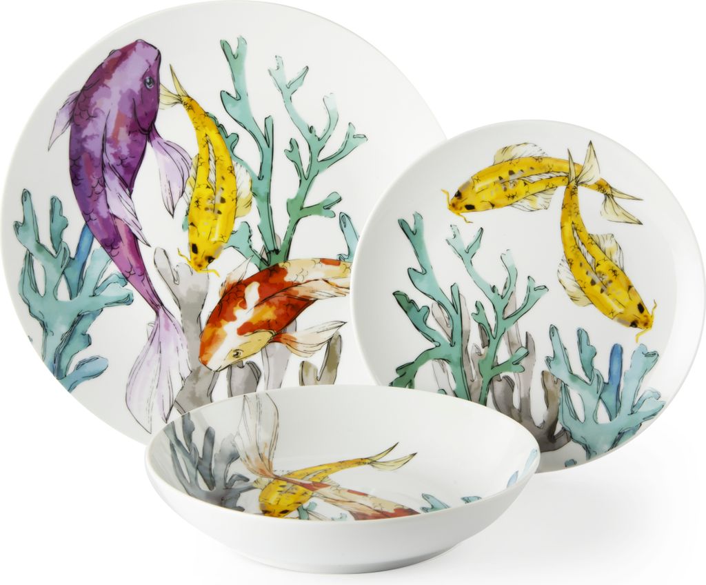 A set of porcelain dishes with a koi fish and coral design.