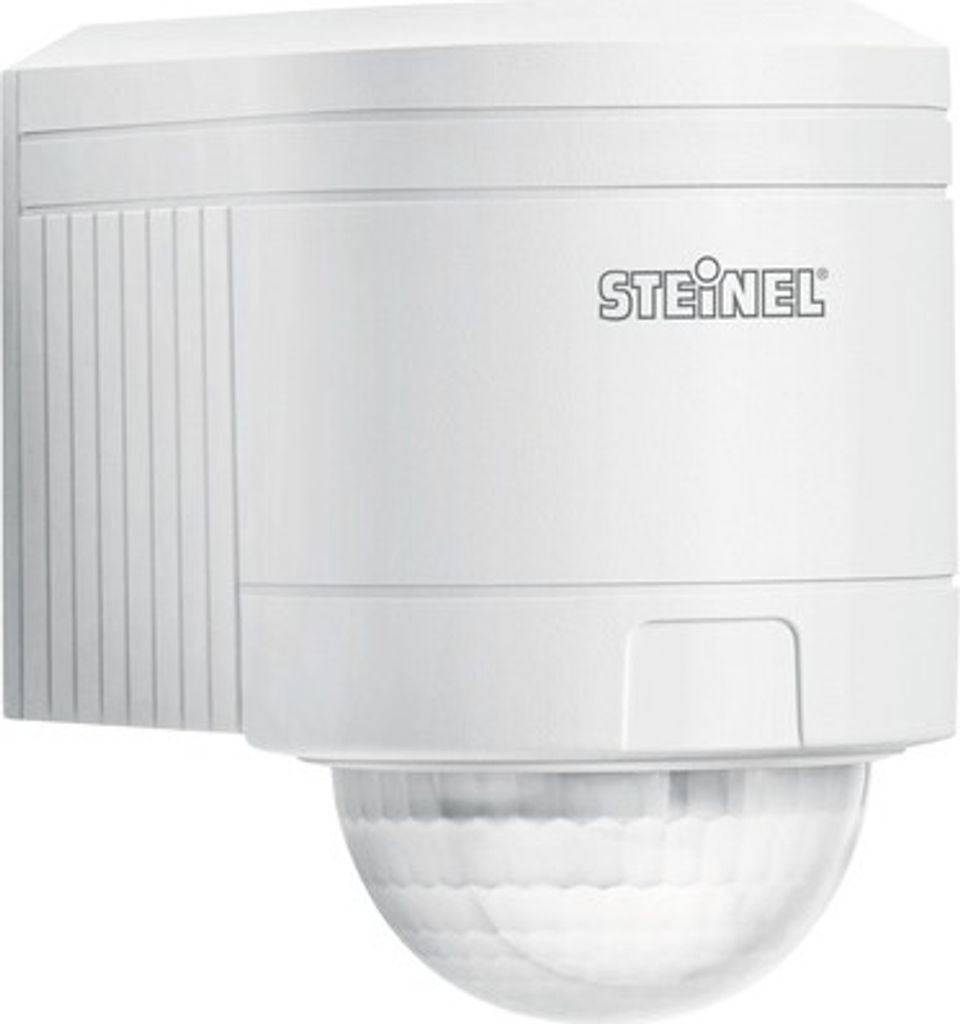 A white infrared motion detector mounted on a wall.
