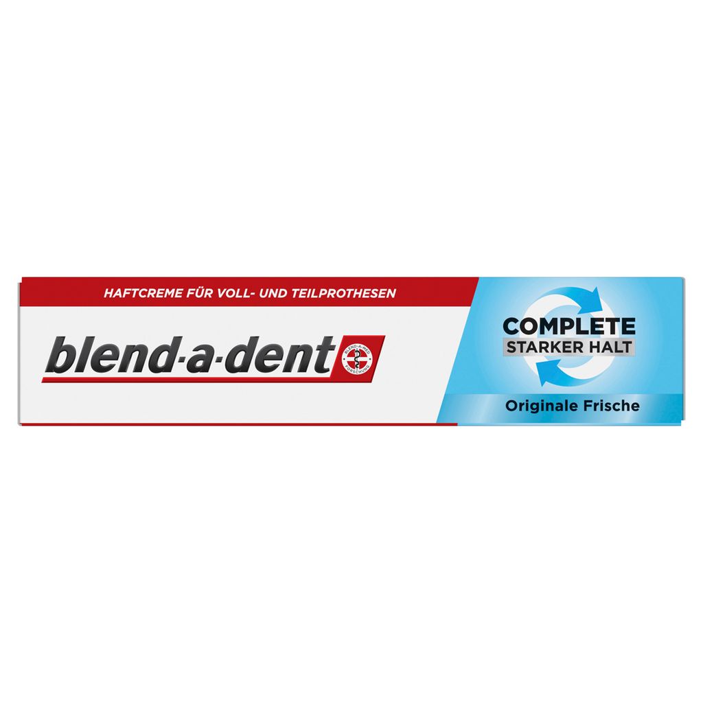 A product shot of a tube of denture adhesive cream.