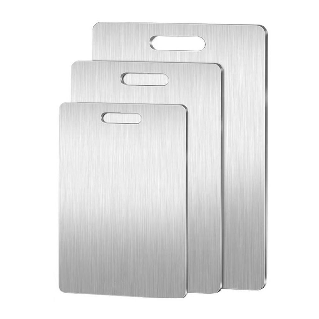 Three stainless steel cutting boards of varying sizes are stacked and displayed against a white background.
