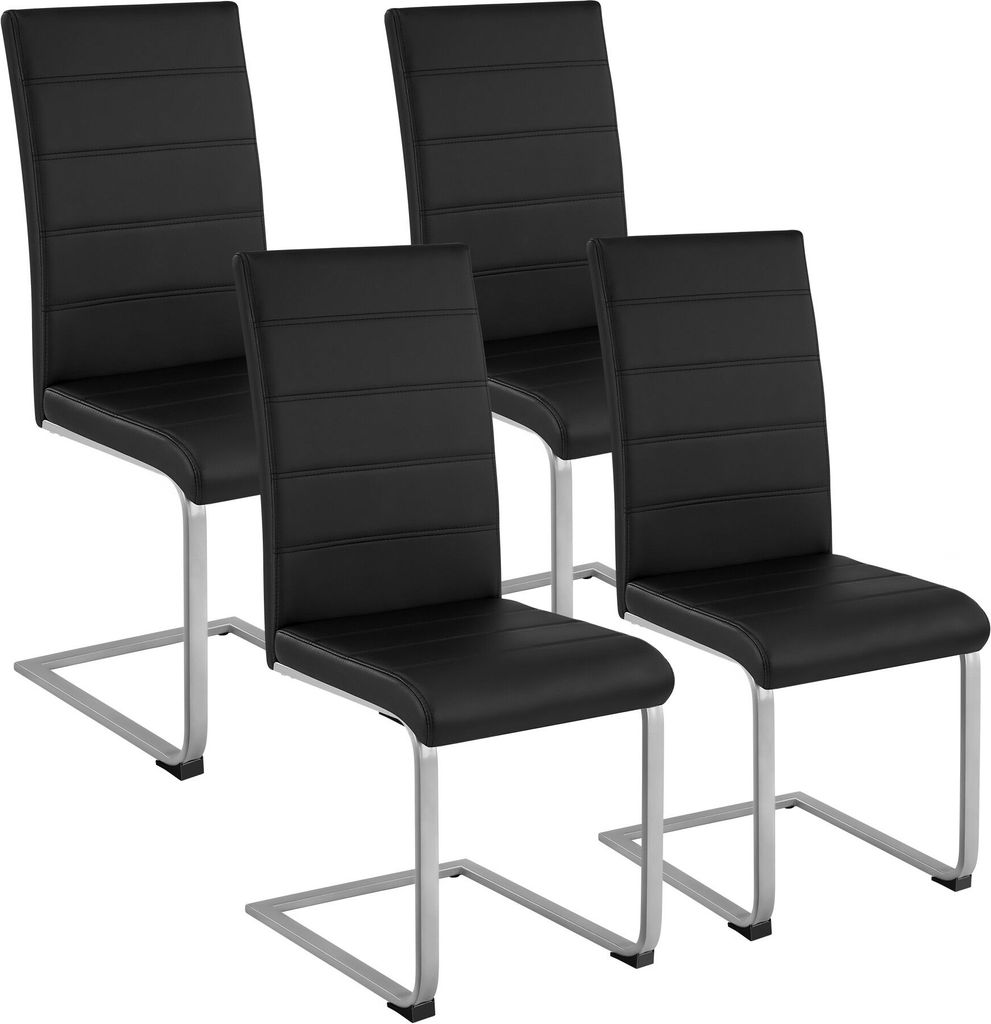 Four black dining chairs with silver metal frames are arranged in a group against a white background.