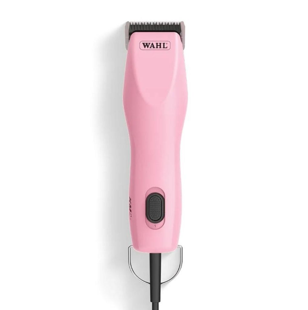 A pink Wahl KM2+ dog clipper is shown against a white background.
