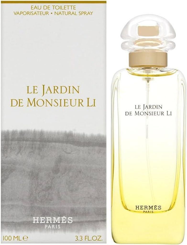 A perfume bottle and its packaging are shown side-by-side against a white background.
