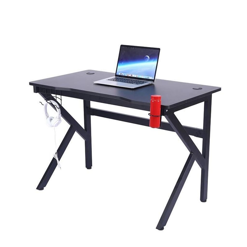 A black gaming desk with a laptop, headphones, and a red cup holder.