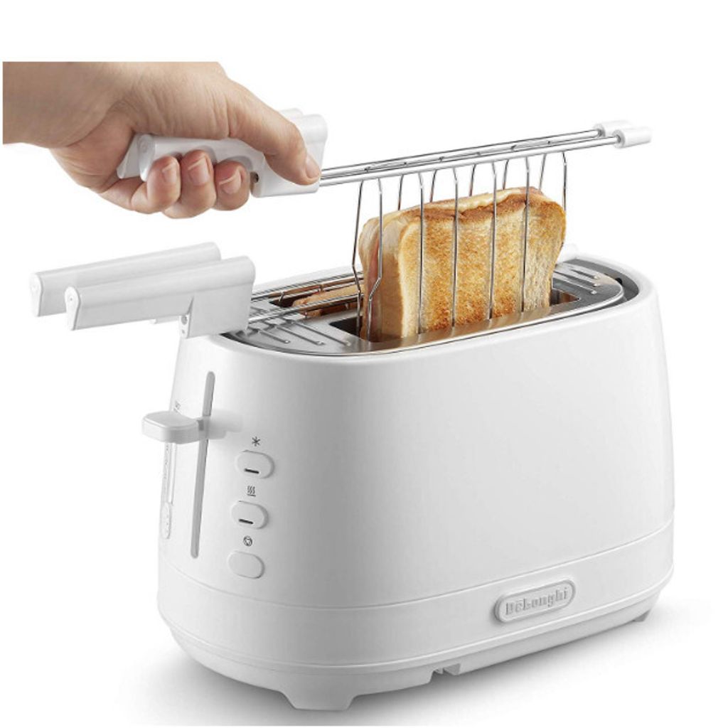 A hand is holding a toaster rack with toast in it, over a white De'Longhi toaster.