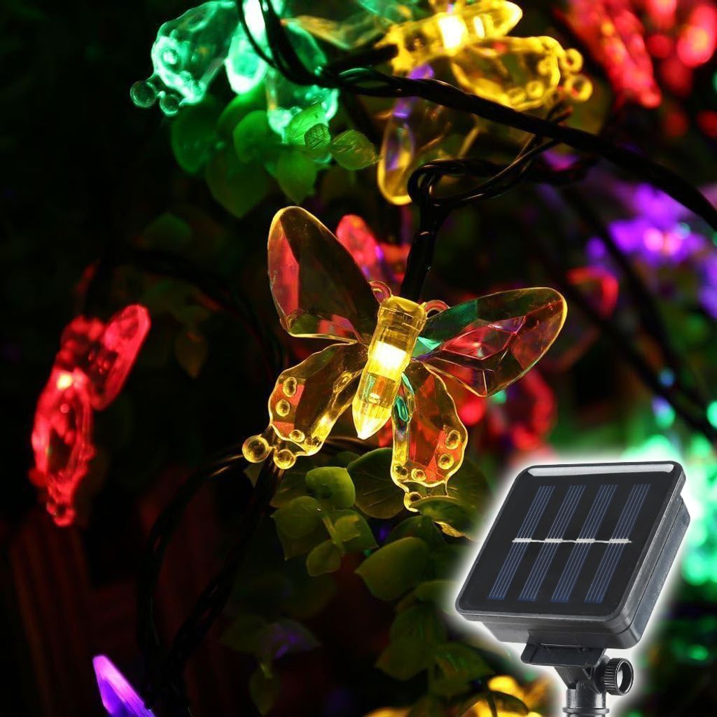 Close-up of solar-powered butterfly-shaped string lights with a solar panel in the foreground.