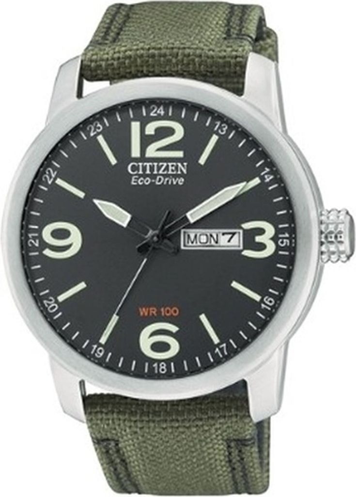 A close-up studio shot of a Citizen Eco-Drive watch with a green canvas strap.