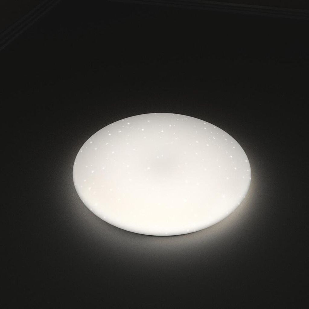 A round, white ceiling light with a glitter effect is shown against a dark background.