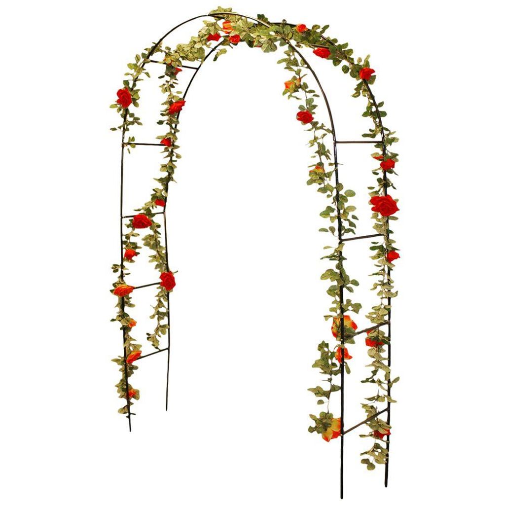 A black metal garden arch decorated with artificial green vines and red and orange roses.