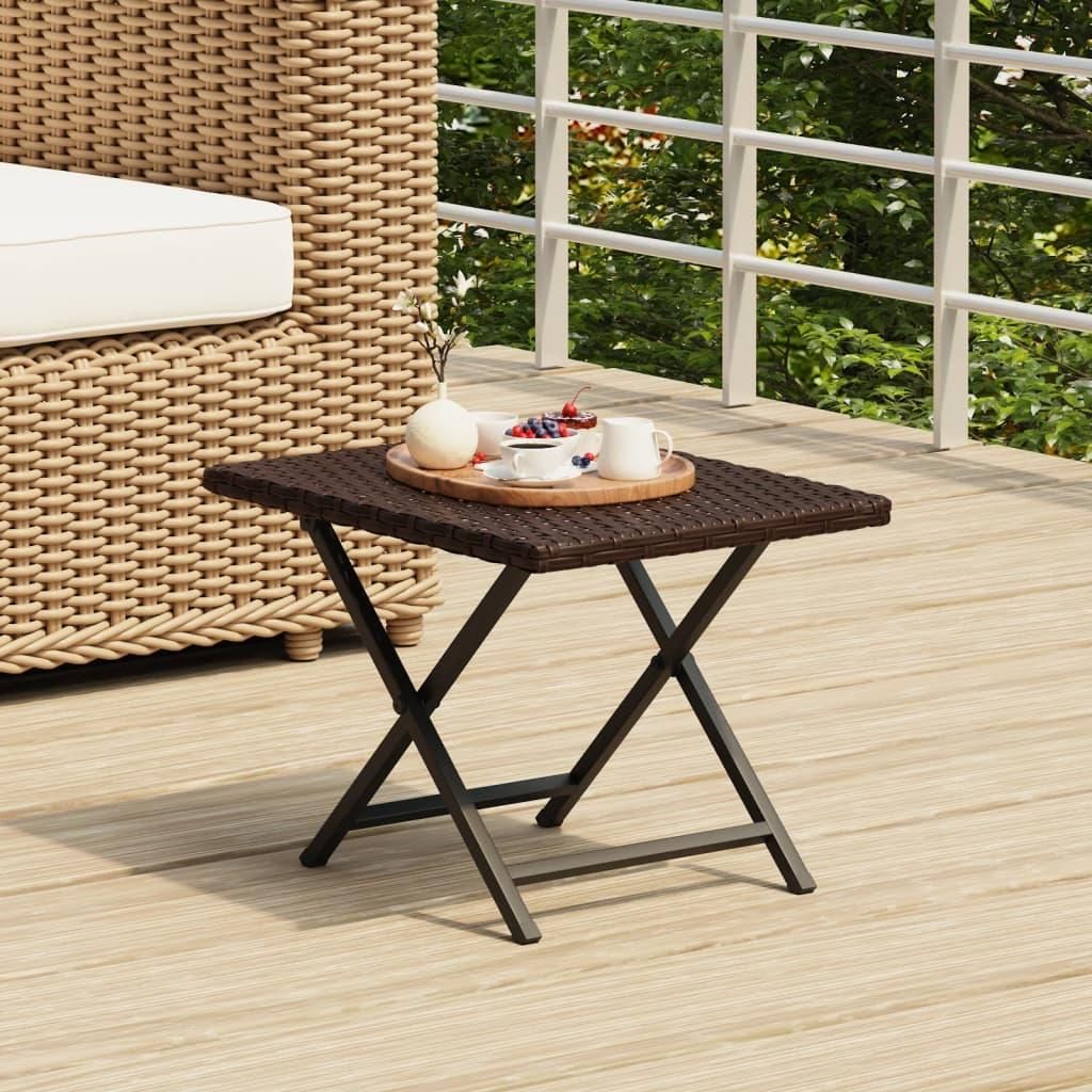 A small folding table with a tray of fruit and drinks on a wooden deck.