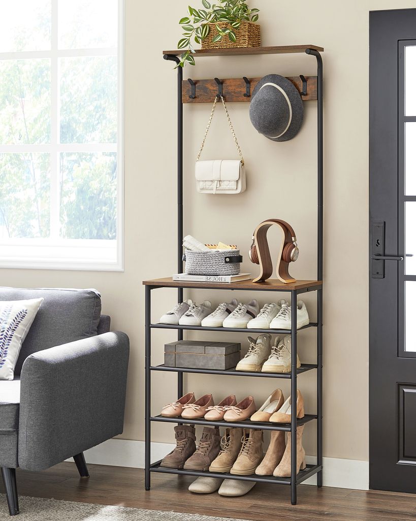 A hallway or entryway scene with a coat rack and shoe storage unit.
