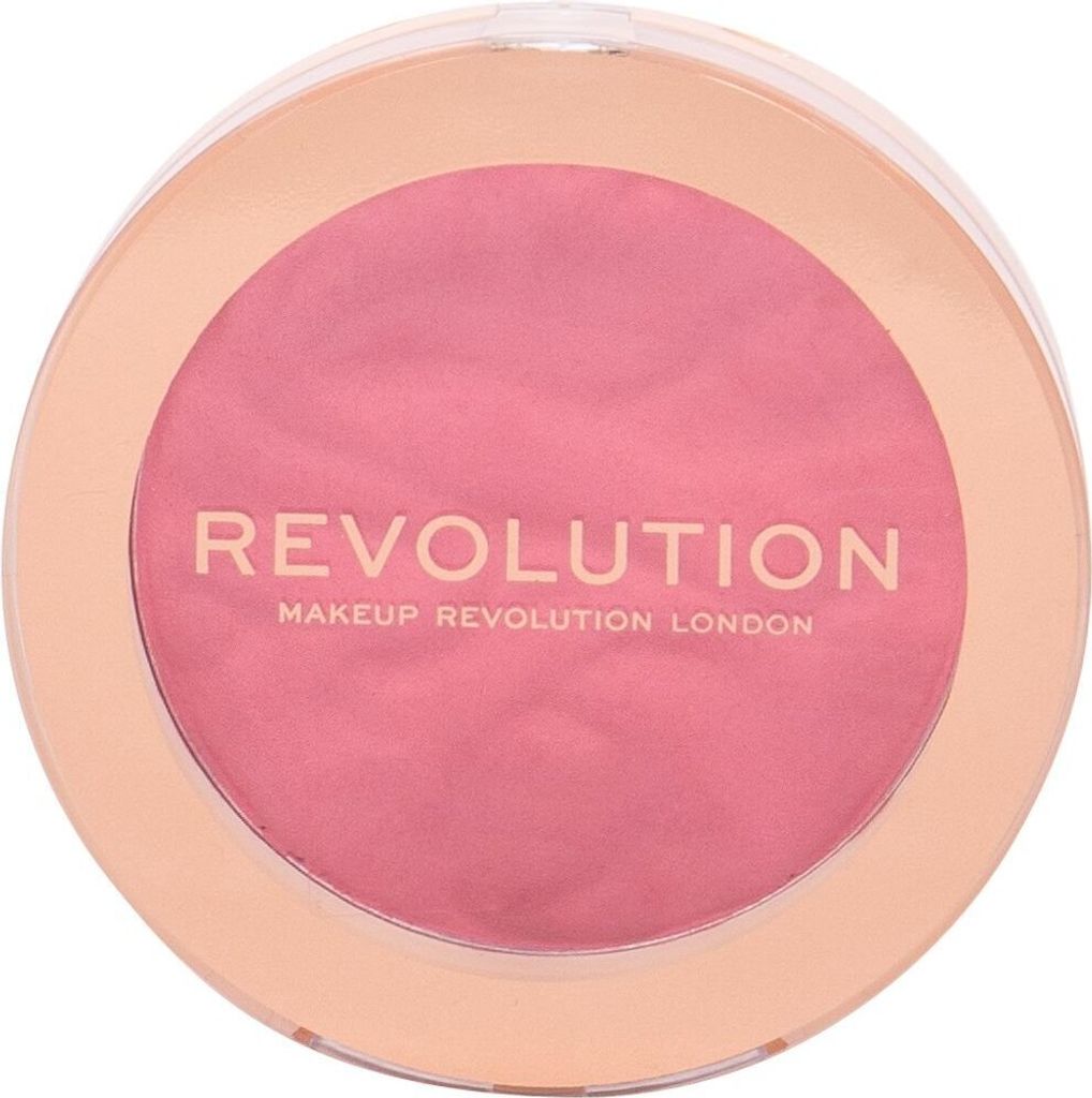 A round makeup compact with pink powder and gold trim.