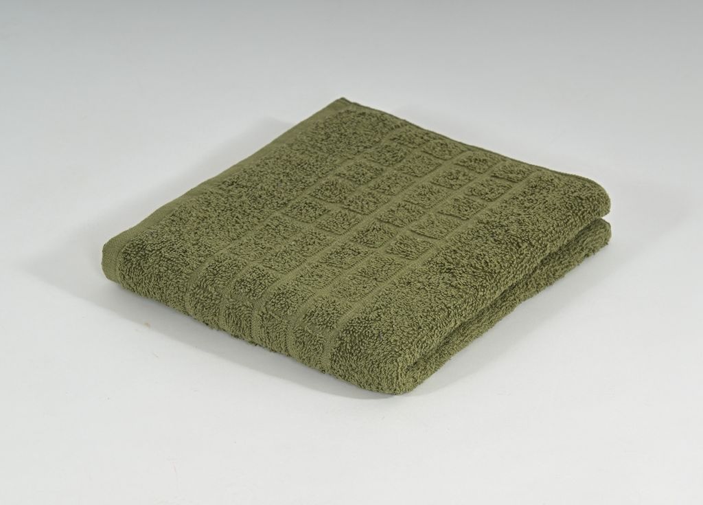 A folded green towel on a white background.