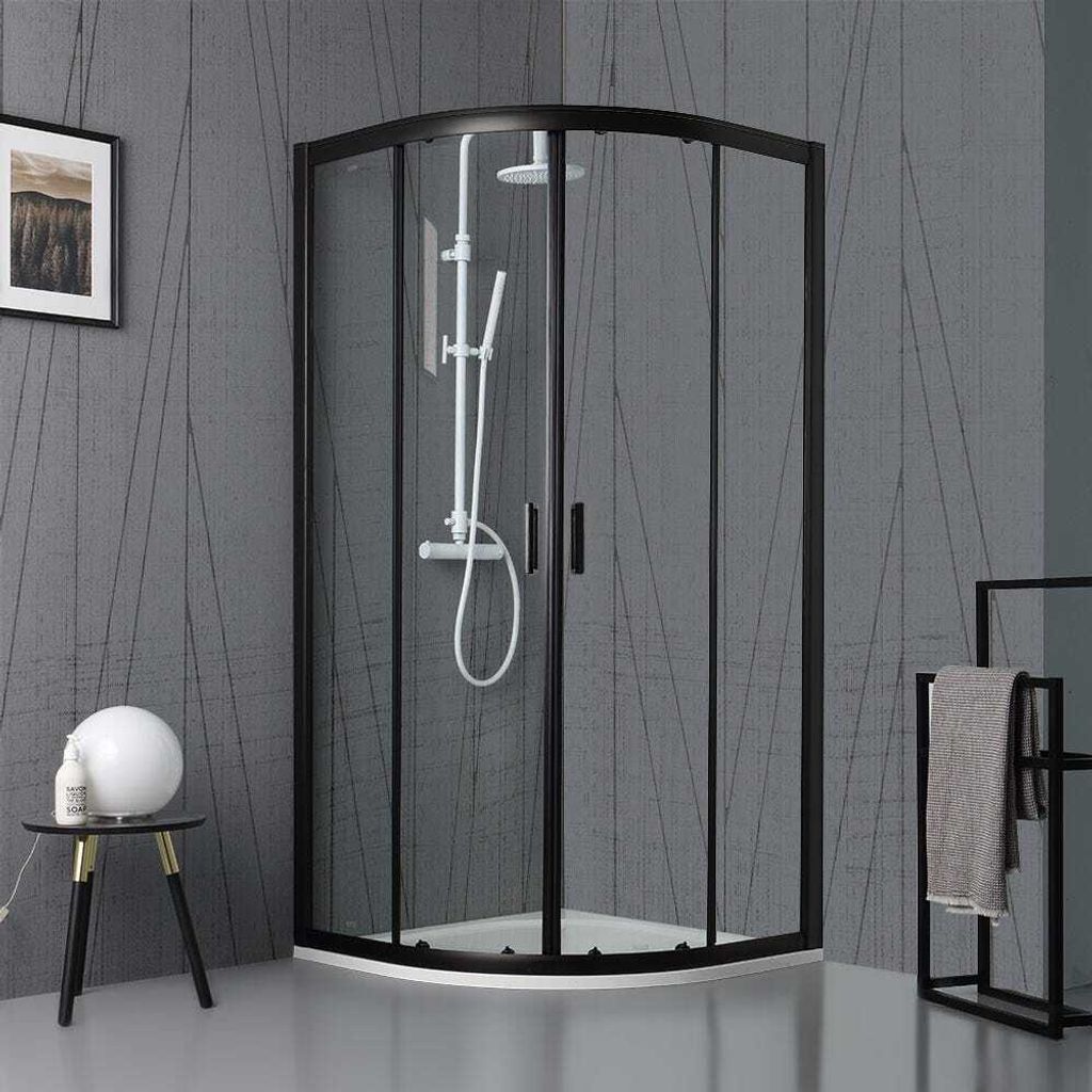 A modern bathroom with a black-framed glass shower enclosure.