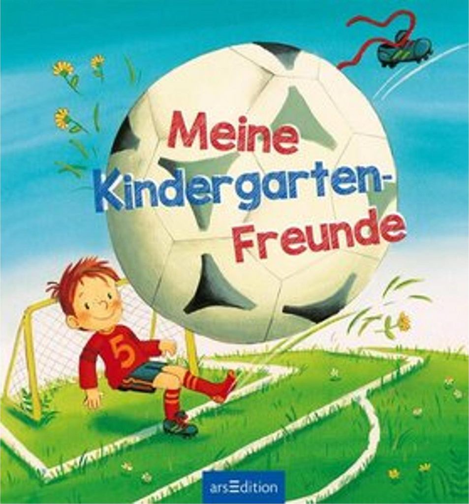 A child playing soccer in front of a large soccer ball with text.