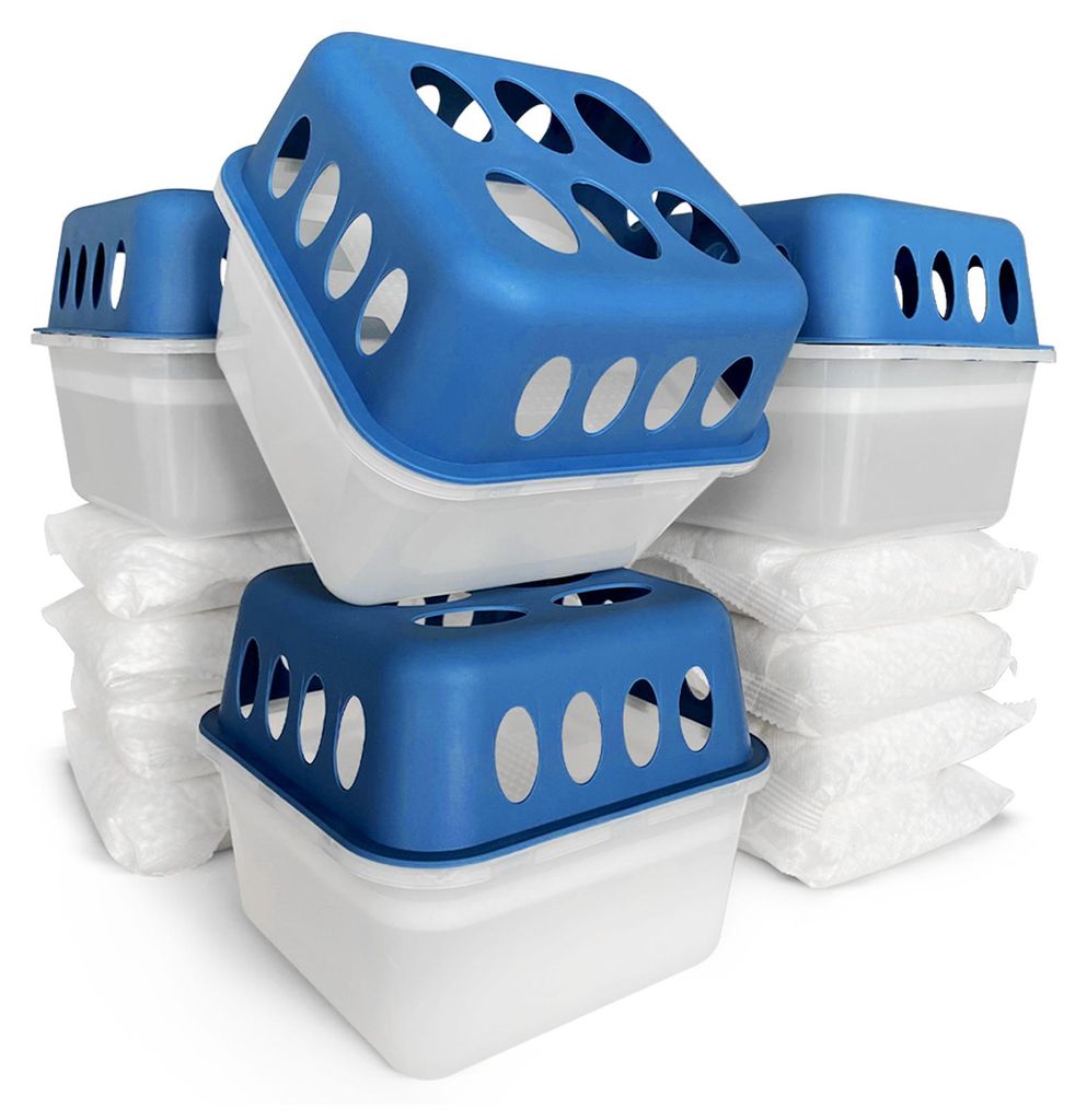 A stack of blue and white dehumidifier units with white packets of desiccant material underneath.