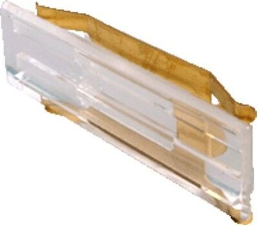 A close-up, angled view of a clear plastic object with gold-colored metal components, against a white background.