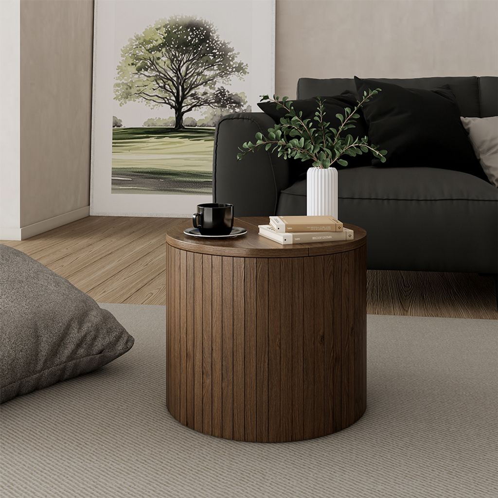 A living room scene with a coffee table, sofa, and artwork.