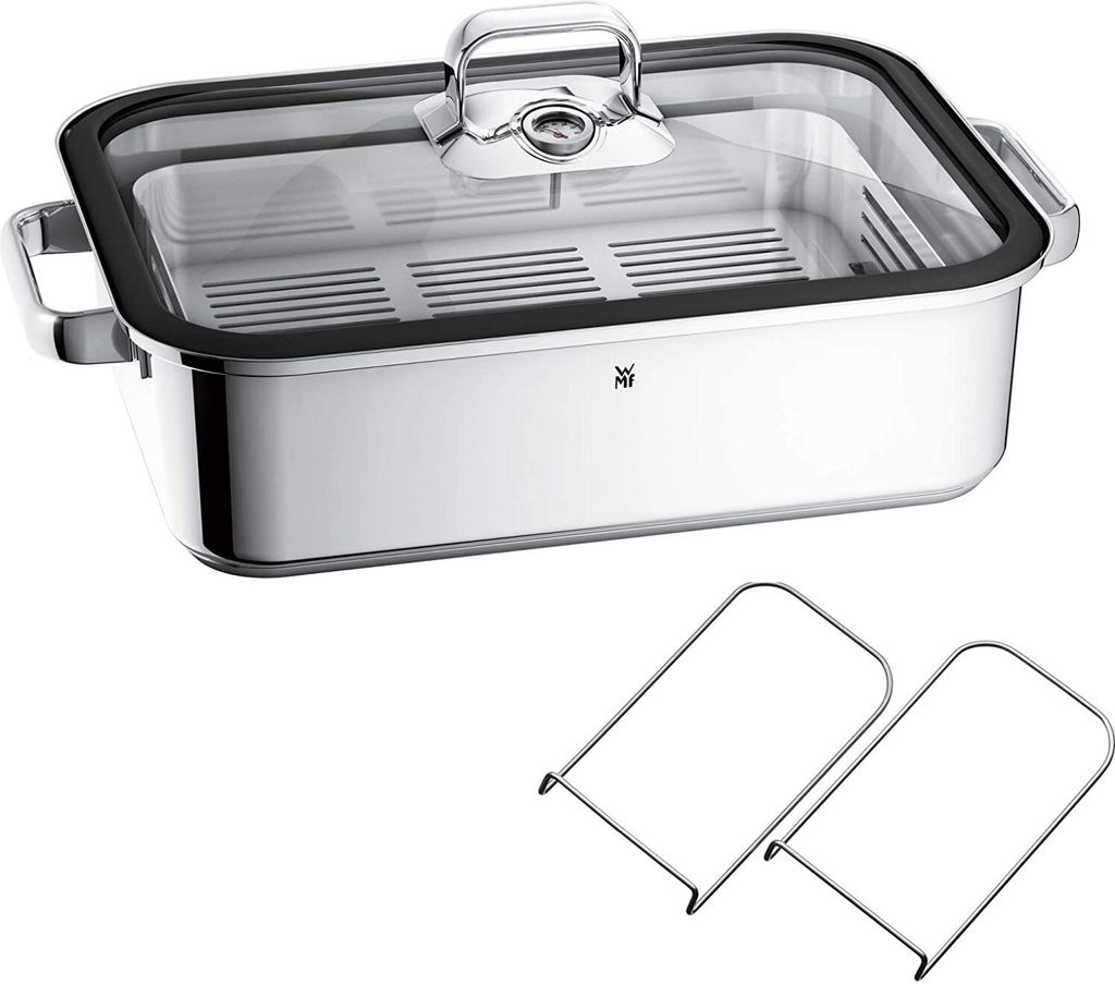 A stainless steel steamer pot with a glass lid and two metal racks.