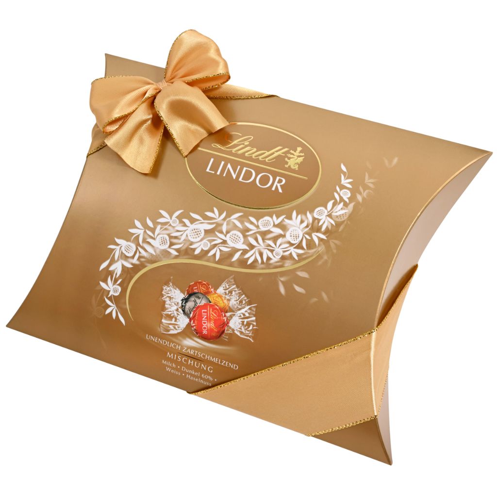 A gold pillow box of Lindt Lindor chocolates, tied with a gold ribbon and bow.