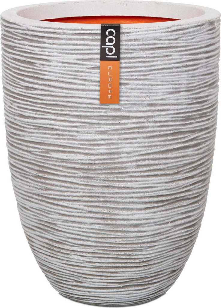 A textured planter pot with a label attached.